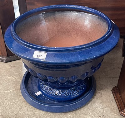 Lot 657 - A 20th century blue glazed terracotta urn,...