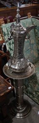 Lot 668 - A large silver plated Arabic Dallah coffee pot,...