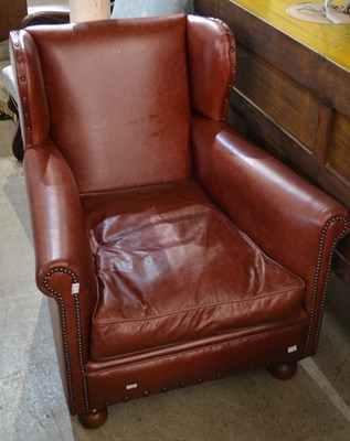 Lot 688 - A vintage style oxblood leather wing back club...