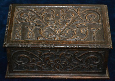 Lot 410 - A 19th century carved oak desk tidy dated 1897,...