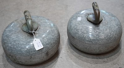 Lot 667 - A pair of 20th century granite curling stones,...