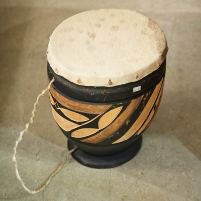Lot 744 - A 20th century African tribal drum, with...