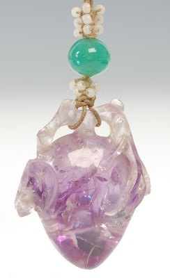 Lot 22 - A Chinese carved amethyst peach fruit and...