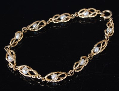 Lot 25 - A 9ct gold bracelet, with ten pearls enclosed...