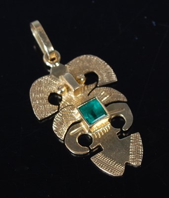 Lot 27 - An 18k gold Aztec Deity pendant set with a...
