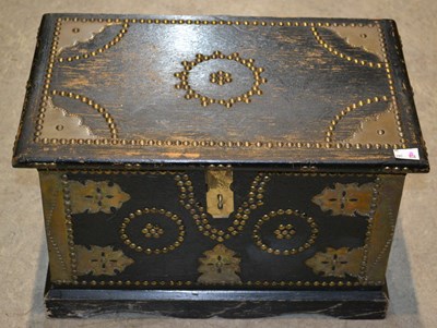 Lot 763 - A small ebonised Zanzibar style studded chest,...