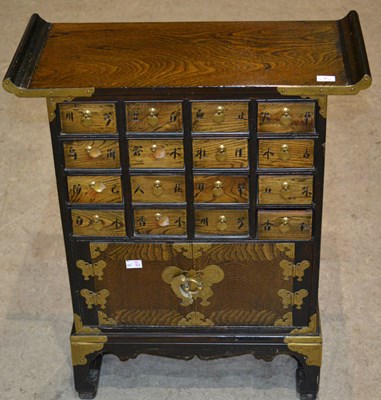 Lot 750 - A Chinese hardwood and brass mounted table...