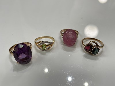 Lot 238 - Four assorted gem set dress rings, to include...