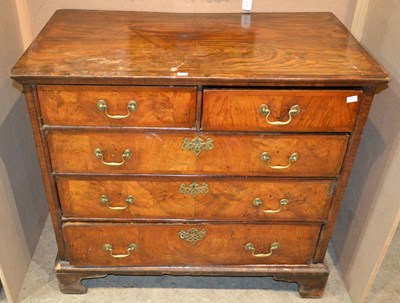 Lot 751 - A George II style walnut chest of drawers,...