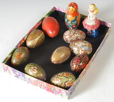 Lot 275 - A collection of hand painted wooden eggs,...