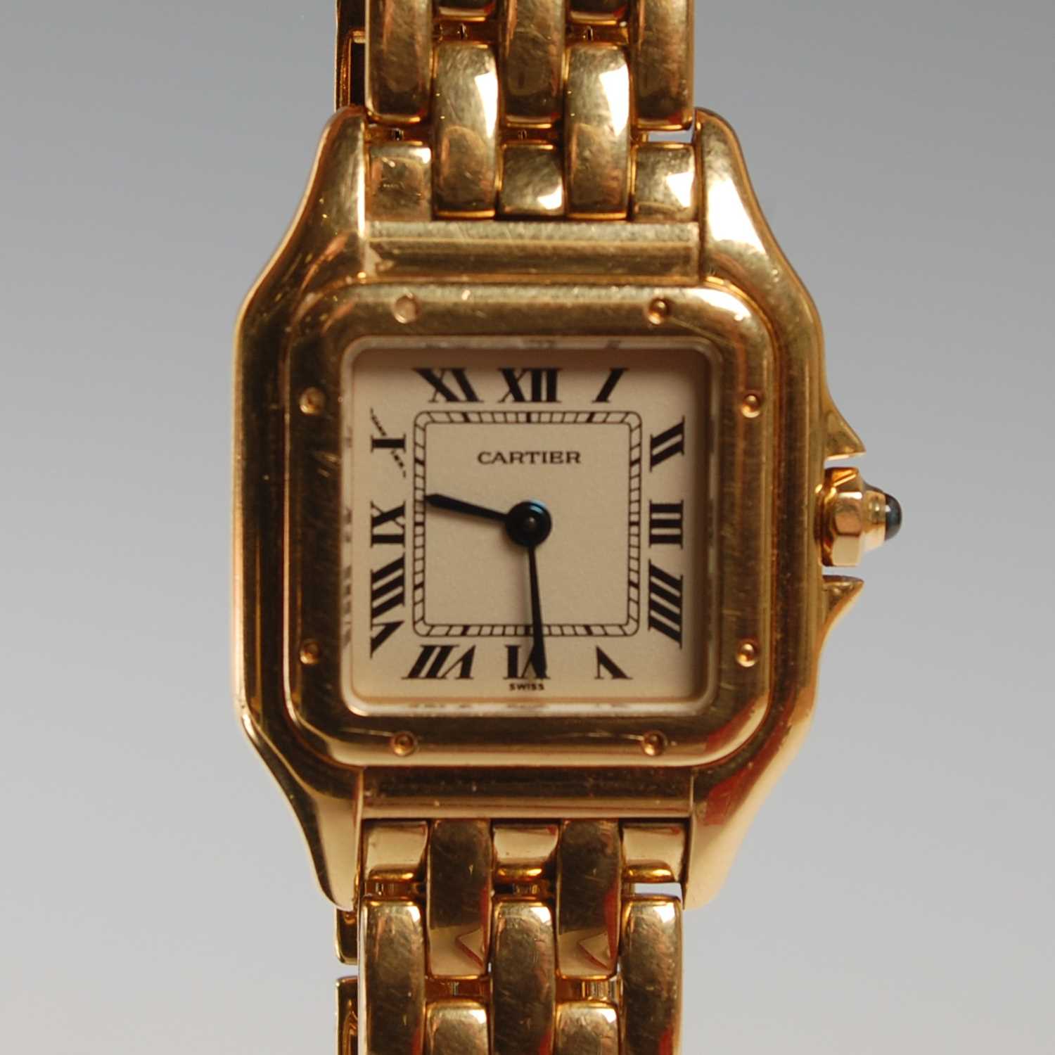 Lot 17 - Cartier, a ladies 18ct gold Panthere bracelet...