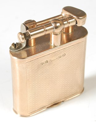 Lot 39 - A 9ct gold lighter, of rounded rectangular...