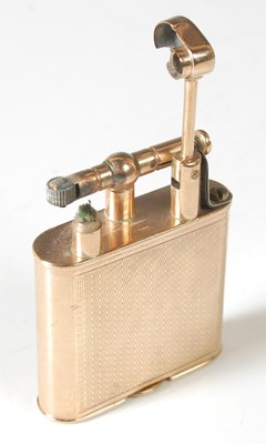 Lot 39 - A 9ct gold lighter, of rounded rectangular...