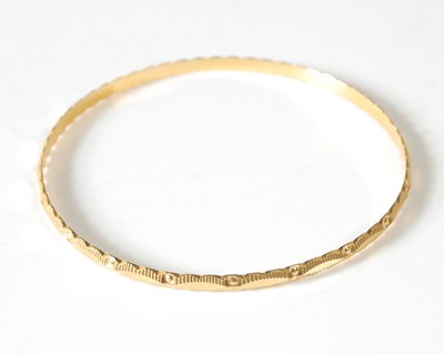 Lot 45 - A Middle Eastern gold bangle, tests as 18ct...