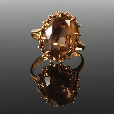 Lot 51 - A 9ct gold and smoky quartz cocktail ring, set...