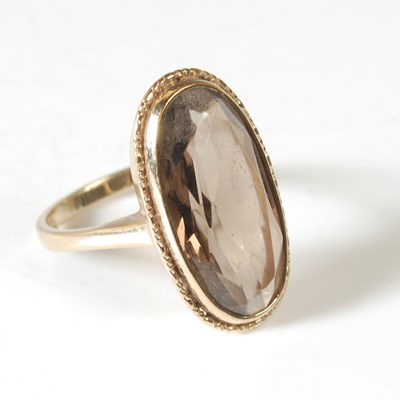 Lot 52 - A 9ct gold and smoky quartz cocktail ring, set...