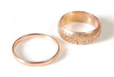 Lot 57 - Two 9ct gold rings, the thinner ring size N, 1....
