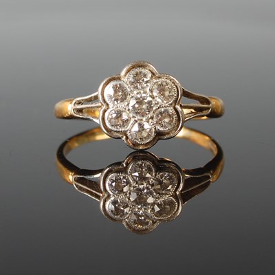 Lot 61 - A white and yellow metal diamond cluster ring,...