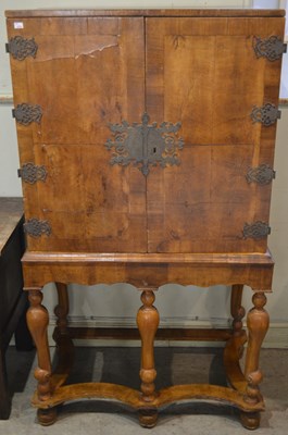 Lot 704 - A William & Mary style cocktail cabinet, the...