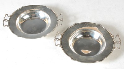 Lot 111 - A pair of Arts & Crafts silver twin handled...