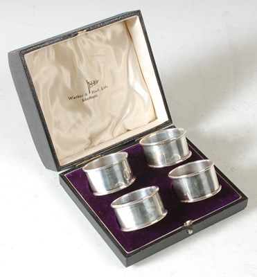 Lot 153 - A cased set of four Sheffield silver napkin...