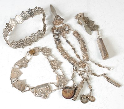 Lot 158 - An antique silver chatelaine, suspending...