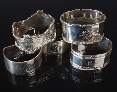 Lot 162 - Five assorted silver napkin rings, 4.2 troy ozs.