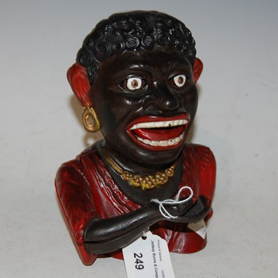 Lot 249 - A cast iron figural money bank inscribed...