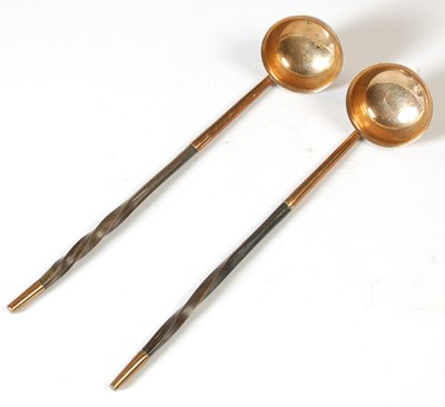 Lot 175 - A pair of antique toddy ladles, with baleen...
