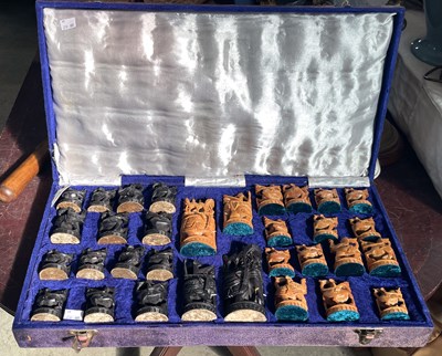 Lot 419 - An antique carved Indian chess set in a...