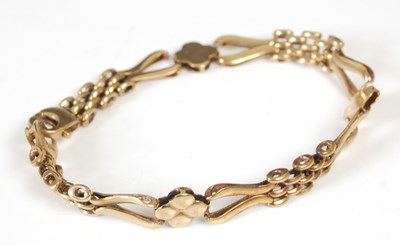 Lot 49D - A 9ct gold mesh link and flower head link...