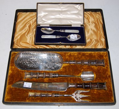 Lot 250 - A cased pair of white metal and...
