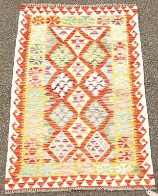 Lot 783 - A Chobi Kilim rug, the mottled orange and red...