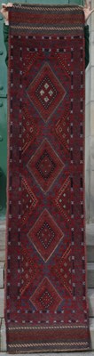 Lot 797 - A Meshwani runner, the madder ground centred...