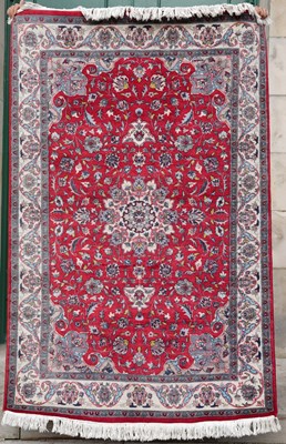 Lot 793 - A Persian Sarouk type rug, the red ground...