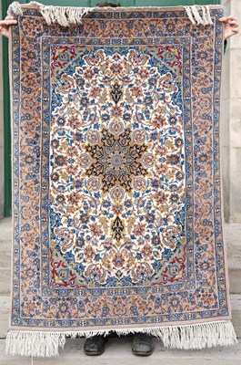 Lot 795 - A Persian Isfahan type silk rug, the ivory...