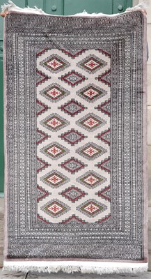 Lot 796 - A Bokhara rug, the pale pink rectangular field...