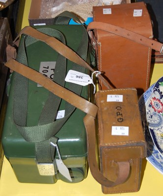 Lot 386 - A vintage bakelite portable telephone, the lid...