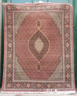 Lot 808 - A Tabriz silk rug, the pale pink rectangular...