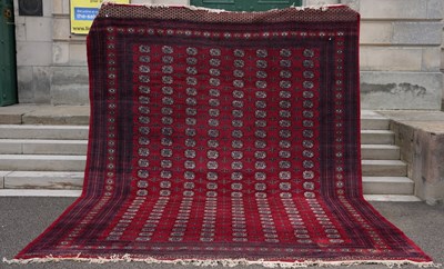 Lot 802 - A large Tekke carpet, the rectangular madder...