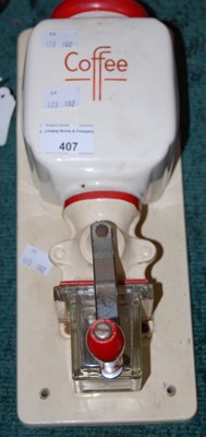 Lot 407 - A vintage wall mounted coffee grinder