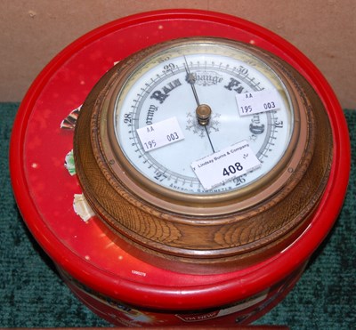 Lot 408 - An oak aneroid barometer, together with a box...