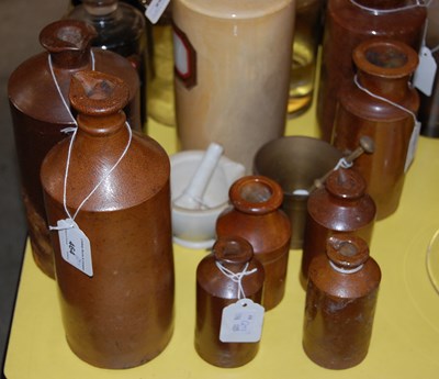 Lot 464 - A collection of stoneware jars / ink bottles,...