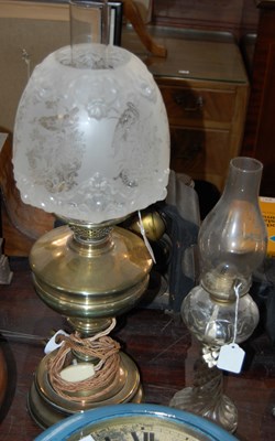 Lot 421 - A brass paraffin lamp converted to electricity...