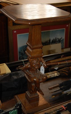 Lot 424 - A stained pine carved plant stand in the form...