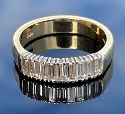 Lot 221C - An 18ct gold and nine stone diamond set ring,...
