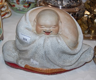 Lot 333 - A Chinese porcelain laughing Buddha, the...