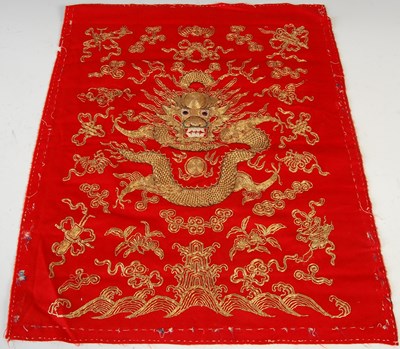 Lot 844 - A Chinese red ground rank badge, together with...