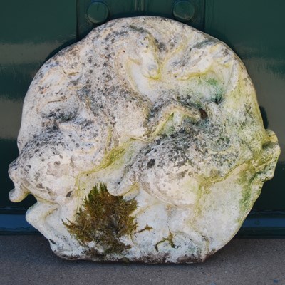 Lot 113 - A composite stone plaque modelled in relief with two rearing horses