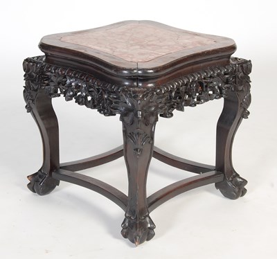 Lot 4 - A Chinese darkwood urn stand, Qing Dynasty